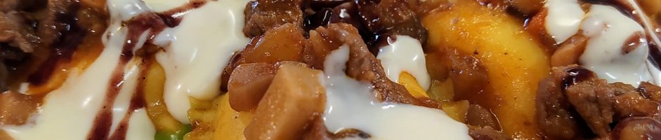 Ravioli di burrata, aggrassato di manzo e funghi cardoncelli